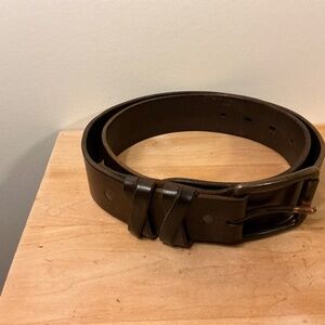 Leather Belt with criss cross design near buckle.
